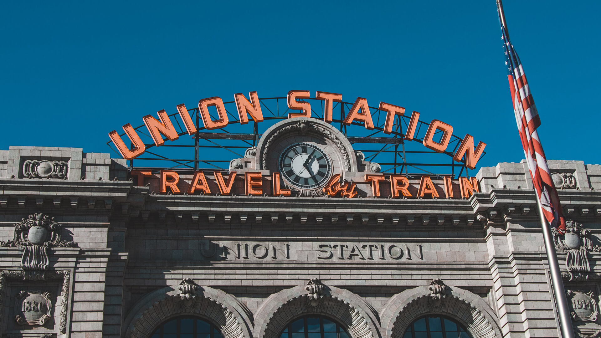 a train station with a clock on top of it.